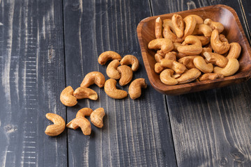 close up of Cashew nut on wooden bowl