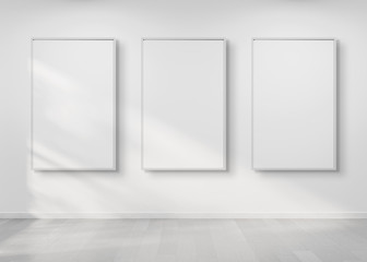 Aufkleber - Three frames hanging on a wall mockup 3d rendering