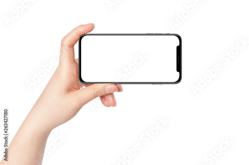 Fotografía Female hand hold modern smartphone in horizontal position, isolated on white background