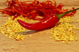 Fototapeta  - Chili pepper in-front of chopped chili pepper