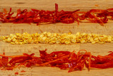 Fototapeta  - Rows of chopped chili pepper and chili seeds