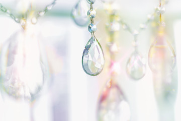 Beautiful multicolored light reflecting through brushed  glass crystals hanging