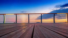 Wooden Platform And Railing On The Background Of A Bright Sunset, Abstract Background
