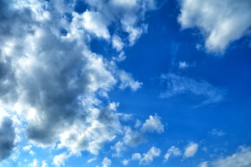 Wall Mural - white clouds with blue sky background.