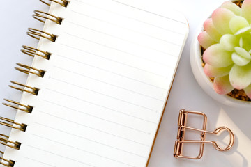 Blank notebook paper on white marble background, with copy space for text, top view