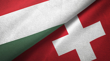 Hungary and Switzerland two flags textile cloth, fabric texture