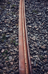 Tram rails on street at sunset, European old town 