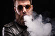 © DC Studio - Relaxed young man with stylish bearded man over black background