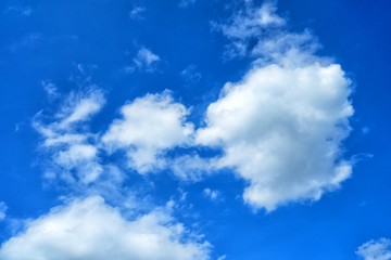 Wall Mural - white clouds with blue sky background.