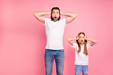 Close up photo beautiful she her little small lady he him his daddy staring on ho expression hold hand arms palms heads wear casual white t-shirts denim jeans isolated pink bright background