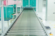 © ekkaluck - The conveyor chain, and conveyor belt on production line set up in clean room area.