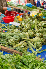 Bunch of fresh raw artichokes heads from artichoke plantation in Argolida, Greece on argicultural market in Nafplio