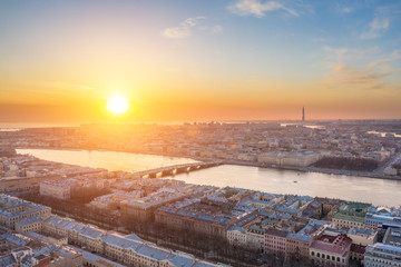 Wall Mural - Evening aerial view at sunset, on the Neva River, Blagoveshchensky Bridge and the city of St. Petersburg.