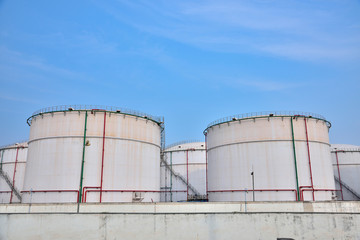 Big white gasoline and oil industry of storage tanks in the blue sky white cloud background