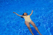 © Deboraht - young indian woman floating in the pool