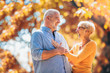 © Mediteraneo - Active seniors on a walk in autumn forest