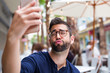 © Deboraht - young man taking a photo of himself in the bar
