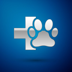 Silver Veterinary clinic symbol icon isolated on blue background. Cross hospital sign. A stylized paw print dog or cat. Pet First Aid sign. Vector Illustration