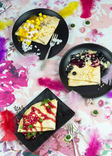 Crepes With Blueberries, Mango And Pomegranate Seeds