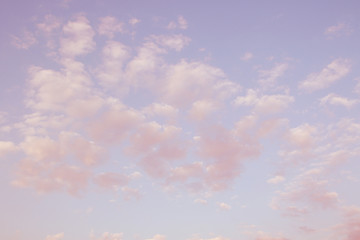 Pink, blue, purple evening sunset sky with cumulus clouds