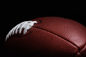 Wall Mural - American football on dark background.