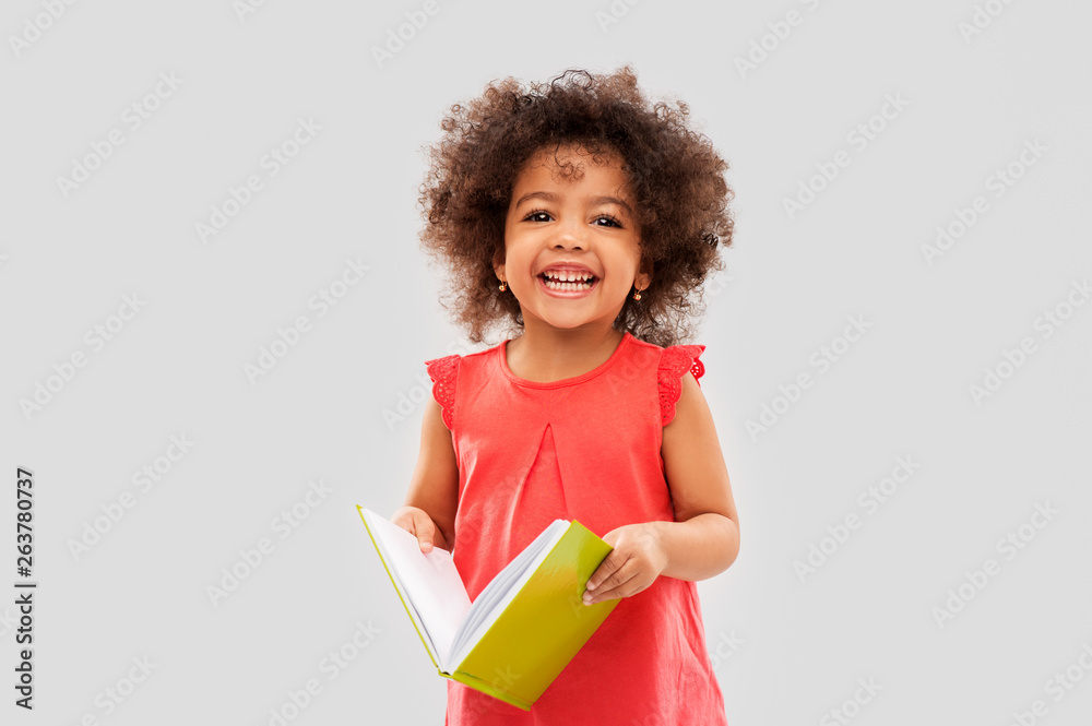 childhood, literature and reading concept - happy little african ...