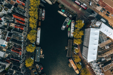 Wall Mural - beautiful aerial amsterdam view from above with many narrow canals, streets and architectures.