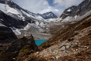 Wall Mural - Milk Lake at the base of Chenrezig, holy snow mountain in Daocheng Yading Nature Reserve - Garze, Kham Tibetan Pilgrimage region of Sichuan Province China. Beautiful Deep Blue Colored Water