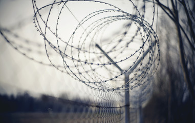 Abstract blurred background with barbed wire.