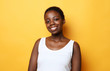© Raisa Kanareva - happy young african woman isolated over yellow background