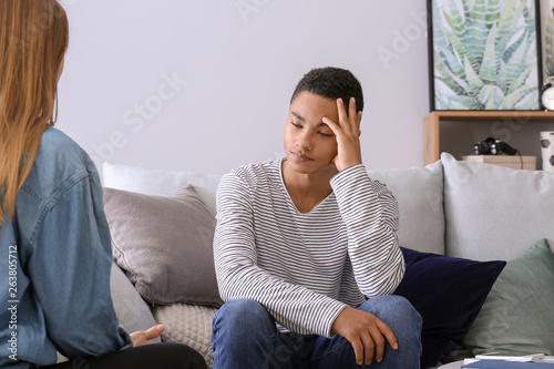 Sad African American Teenage Boy Having Argument With His Mother