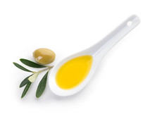 Spoon With Tasty Olive Oil On White Background