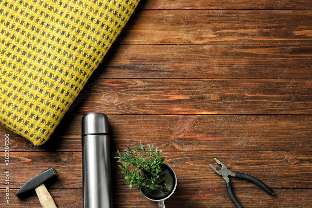 Set of items for tourist on wooden background