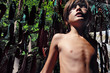© Stas Pylypets/Stocksy - Portrait of a boy with long hair