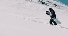 Snowboarder Walking In The Fresh Powder Snow