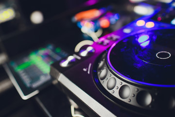 Male DJ playing music in club, top view.