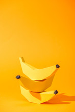 Yellow Paper Bananas On Orange With Copy Space