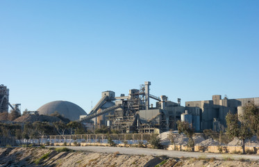 CARBONERAS, ALMERÍA, ANDALUSIA, SPAIN. March 3, 2019: Panoramic view of the cement factory of Carboneras, in the natural park of Cabo de Gata.