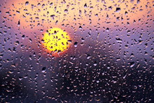 Raindrops On The Glass And Sunset. Weather Forecast.
