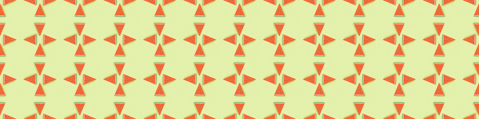 Sticker - panoramic shot of seamless pattern with handmade paper watermelon slices isolated on green