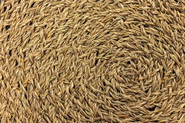 Woven yellow wicker straw background or textur