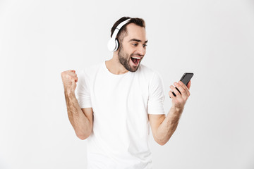 Wall Mural - Handsome cheerful man wearing blank t-shirt