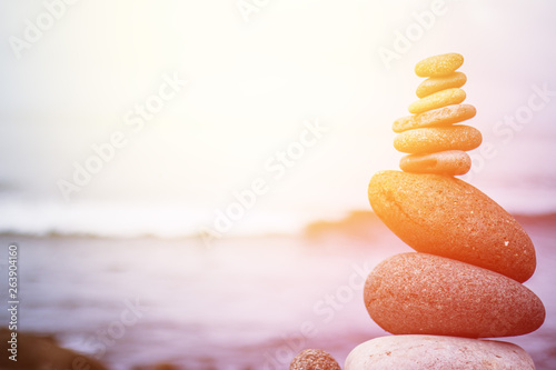 Fotografía Balance, relaxation and wellness: Stone cairn outside, ocean in the blurry background