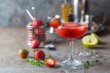 Wall Mural - Ice Strawberry alcohol cocktail with lime and rum in a glass