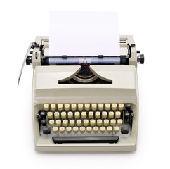 Fototapete - Top view of a typewriter from the 70s with blank paper for text, isolated on white background. Contains clipping path.