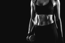 Black And White Photo Of The Press Girl Holding A Dumbbell In Her Hand.