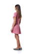 © paffy - Back view Full length of young woman in pink dress standing casually