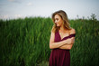 © AS Photo Family - Blonde sensual woman in red marsala dress posing in the reeds.