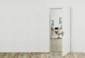 Stylish home office interior, view through open door. Space for text