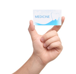 Wall Mural - Man holding business card isolated on white, closeup. Dental medical service